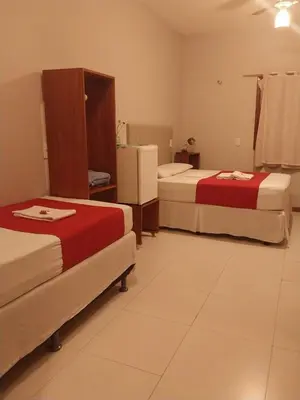 Uma cama ou camas num quarto em Pousada Munguba