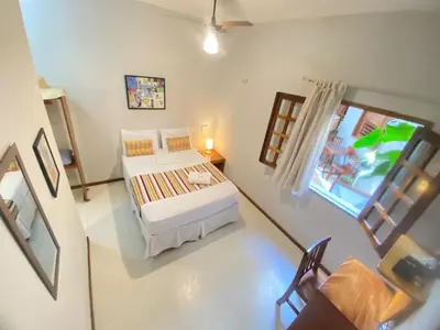 Uma cama ou camas num quarto em Pousada Munguba