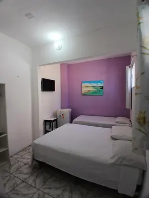 Uma cama ou camas num quarto em Pousada do Castelo