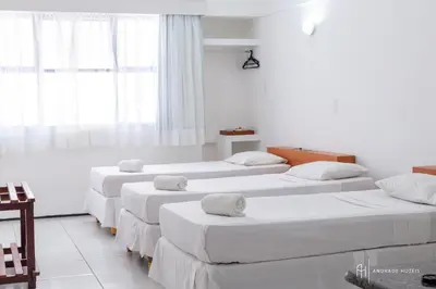 Uma cama ou camas num quarto em Rede Andrade Coimbra