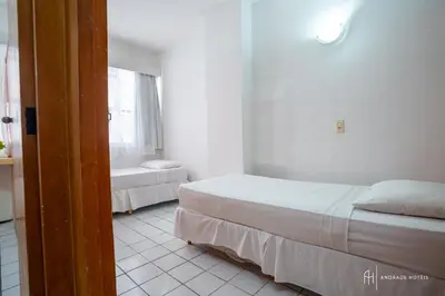 Uma cama ou camas num quarto em Rede Andrade Coimbra