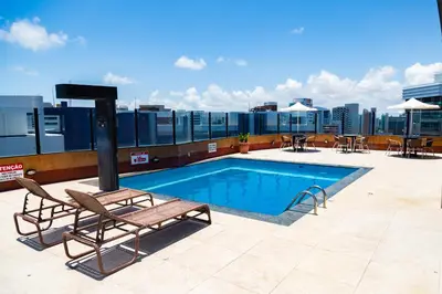 A piscina em ou perto de Plaza Praia Suítes