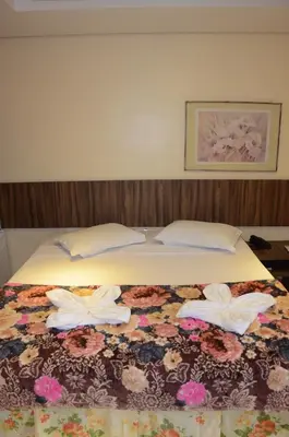 Uma cama ou camas num quarto em Ara Mar Praia Hotel