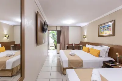 Uma cama ou camas num quarto em Amuarama Hotel