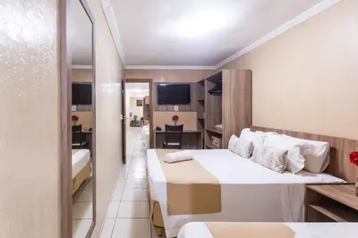 Uma cama ou camas num quarto em Amuarama Hotel