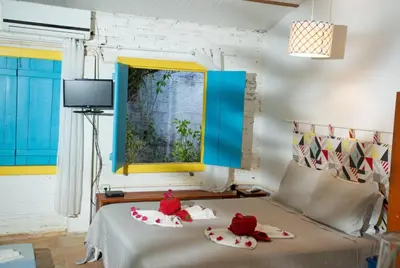 Uma cama ou camas num quarto em Barriga Da Lua Flats