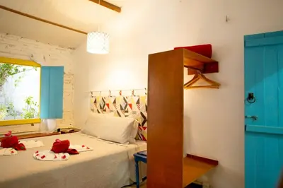 Uma cama ou camas num quarto em Barriga Da Lua Flats