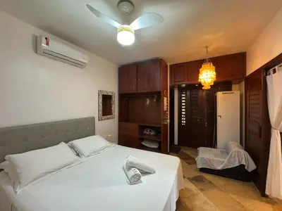 Uma cama ou camas num quarto em Serrote Breezes Apartamento 04