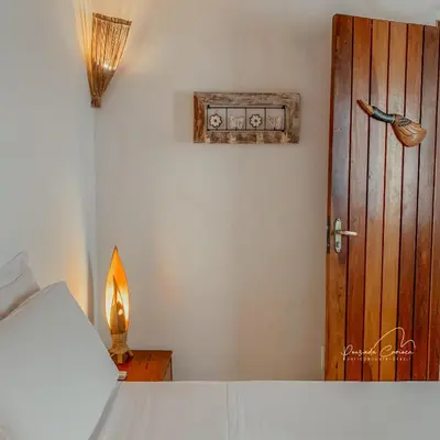 Uma cama ou camas num quarto em Pousada Carioca - Pousada de Charme