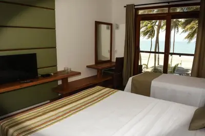 Uma cama ou camas num quarto em Genus Beach Hotel