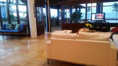 Uma área de estar em Casa de Praia em Mundaú