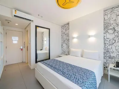 Uma cama ou camas num quarto em Golden Tower Maracanaú by Fênix Hotéis
