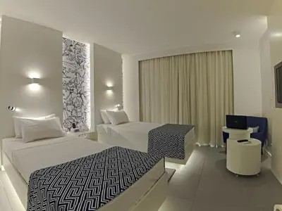 Uma cama ou camas num quarto em Golden Tower Maracanaú by Fênix Hotéis