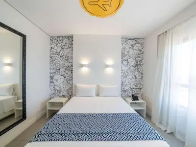 Uma cama ou camas num quarto em Golden Tower Maracanaú by Fênix Hotéis