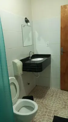 Uma casa de banho em Pousada e Pizzaria Sol e Alegria