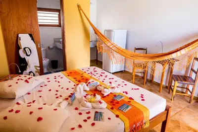 Uma cama ou camas num quarto em Cumbuco Kite in Paradise e Hospedaria