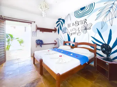 Uma cama ou camas num quarto em Cumbuco Kite in Paradise e Hospedaria