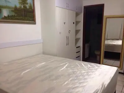 Uma cama ou camas num quarto em Flat Vista Completa Beira Mar
