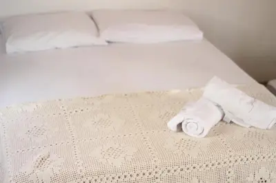 Uma cama ou camas num quarto em Pousada Infinito Azul