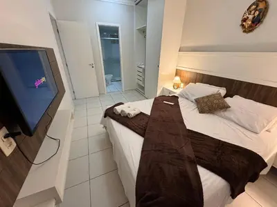 Uma cama ou camas num quarto em Beach Living, Frente mar, Vizinho B Park - Oficial