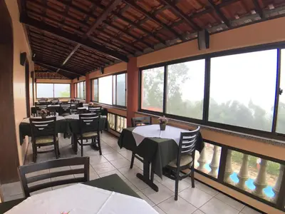 Uma área de estar em Le Rêve Pousada e Restaurante