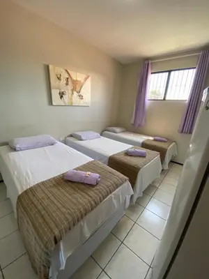 Uma cama ou camas num quarto em Center 1 Hotel