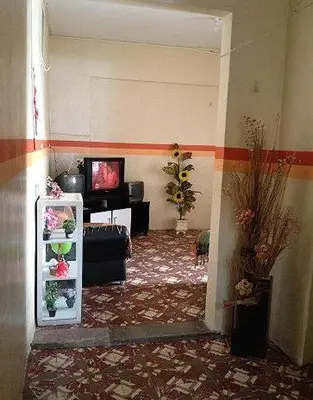 Uma televisão e/ou sistema de entretenimento em Hospedaria Praia e Sol