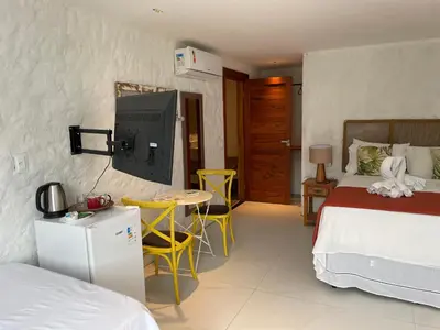 Uma cama ou camas num quarto em Pousada Monteflor Guaramiranga-CE