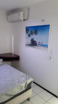Uma cama ou camas num quarto em Apartamentos Vila de Iracema