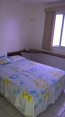 Uma cama ou camas num quarto em Apartamentos Vila de Iracema