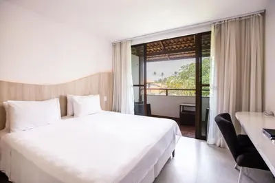 Uma cama ou camas num quarto em Duro Beach Garden Hotel