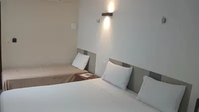 Uma cama ou camas num quarto em Ruan Beach