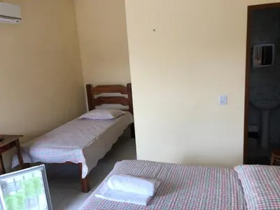 Uma cama ou camas num quarto em Pousada Águas Claras