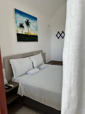 Uma cama ou camas num quarto em Pousada Amor a Mar Pé na Areia na Praia de Barreiras, Icapuí