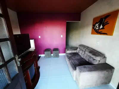 Uma televisão e/ou sistema de entretenimento em Apartamento Central