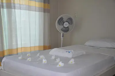 Uma cama ou camas num quarto em Brisa Mar