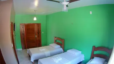 Uma cama ou camas num quarto em Pousada e Restaurante Lagoa Azul