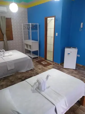 Uma cama ou camas num quarto em Pousada e Restaurante Lagoa Azul
