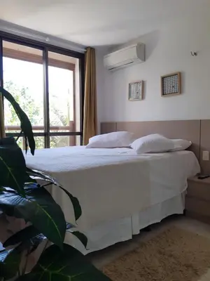 Uma cama ou camas num quarto em Apartamento Waiwai Cumbuco