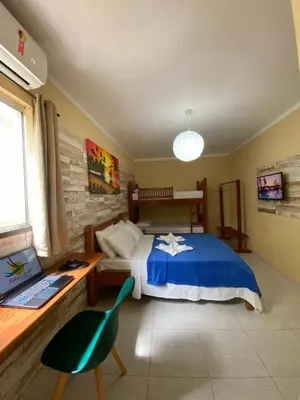 Uma cama ou camas num quarto em Refúgio Pousada Fortaleza