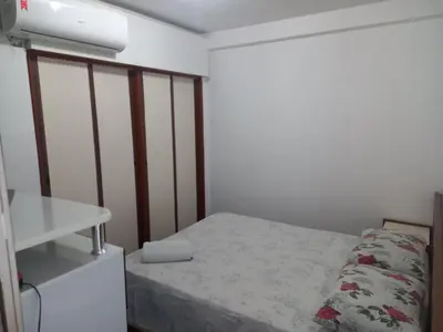 Uma cama ou camas num quarto em Atlantico Residence Beira Mar