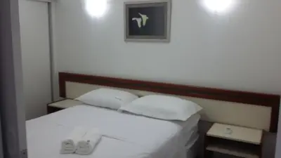 Uma cama ou camas num quarto em Atlantico Residence Beira Mar