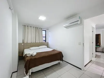 Uma cama ou camas num quarto em Flat Praia de Iracema Vista Mar