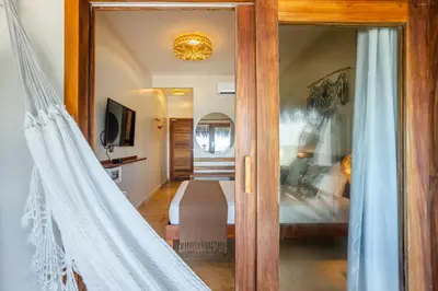 Uma cama ou camas num quarto em Pousada Preamar
