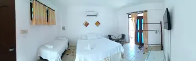 Uma cama ou camas num quarto em Hotel Pousada Summer Way