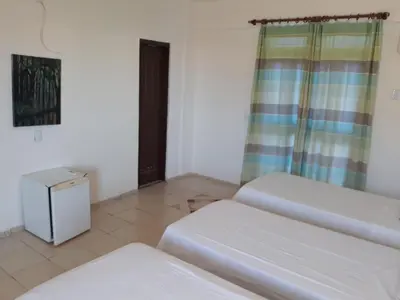 Uma cama ou camas num quarto em Hotel Pousada Summer Way