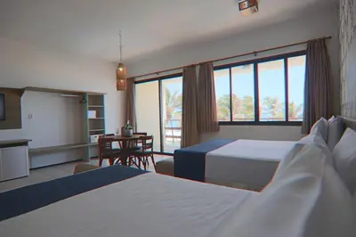 Uma cama ou camas num quarto em G2 Beach Hotel