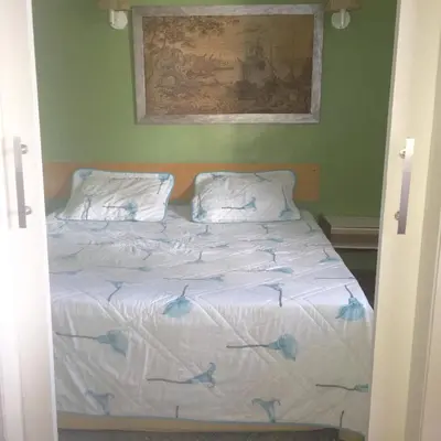 Uma cama ou camas num quarto em Atlântico Flat Residence