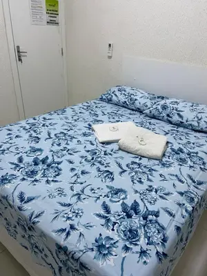 Uma cama ou camas num quarto em Pousada Green Aeroporto Rodoviária
