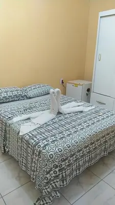 Uma cama ou camas num quarto em Pousada Green Aeroporto Rodoviária